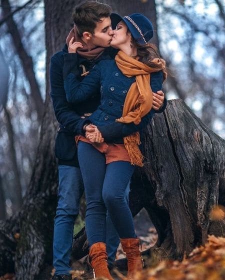 Couple in love kissing under a tree