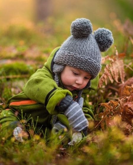 Kid in autumn grass
